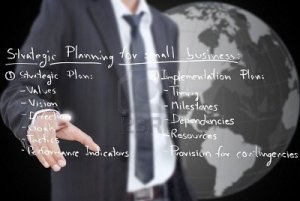 Whiteboard--business man-strategic-planning-on-the-whiteboard